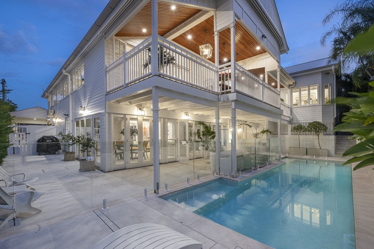 Two-storey Hamptons-style home with poolside terrace
