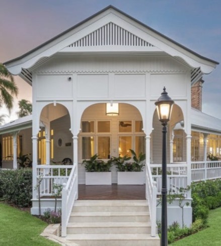 Classic Queenslander facade with gabled verandah at dusk